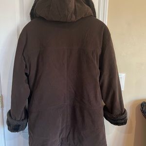 Brown coat with fur around the neck and lapel